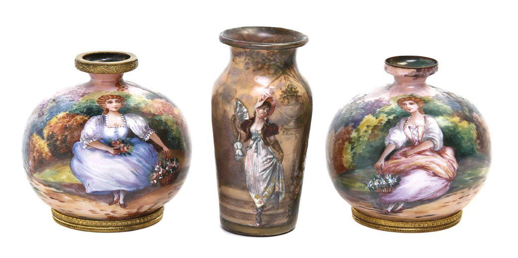 Three French Enameled Copper Vases, Height of tall: Three French Enameled Copper Vases, comprising a pair of bud vases decorated with maidens, and a diminutive vase decorated with a lady in a garden setting. Height of tallest 3 1/2 inches.