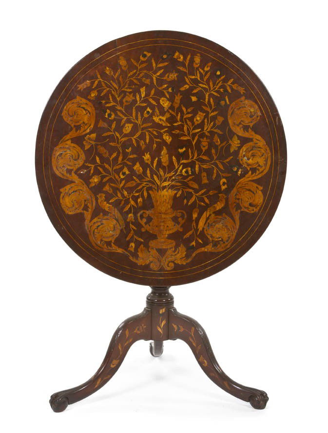 A Continental Marquetry Tea Table, Height 28 1/2 x: A Continental Marquetry Tea Table, having a circular tilt-top with inlaid decoration of an urn issuing flowers, raised on a tripartite base with paw feet. Height 28 1/2 x diameter 29 1/2 inches.