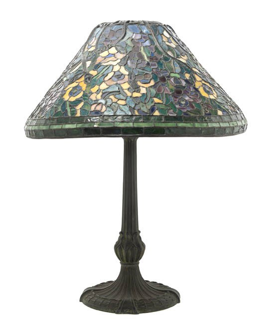 An American Leaded Glass Shade, after Tiffany Stud: An American Leaded Glass Shade, after Tiffany Studios, of conical form, with allover floral decoration, raised on a Neoclassical cast metal base. Height 24 inches.