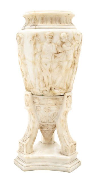 A Continental Alabaster Lamp, Height 16 1/4 inches: A Continental Alabaster Lamp, in three parts, the body decorated with a continuous band of classical figures, raised on a tripartite base. Height 16 1/4 inches.