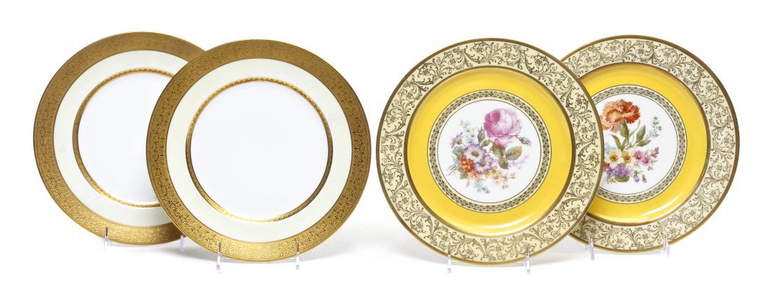 A Set of Six Bavarian Service Plates, Diameter of: A Set of Six Bavarian Service Plates, each centered with a floral spray within a gilt and yellow border, together with six Bavarian dinner plates with gilt and ivory borders. Diameter of first 10 3/4 