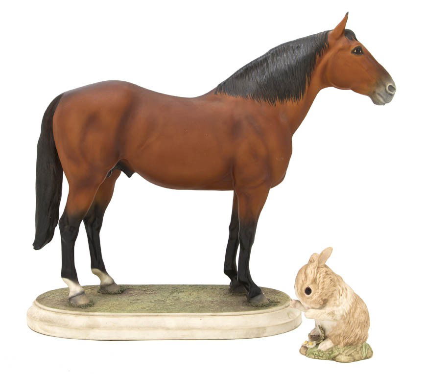 A Boehm Figure of a Horse, Width of first 15 inch: A Boehm Figure of a Horse, naturalistically modeled, standing on an oval base, together with a Cybis figure of a bunny. Width of first 15 inches.