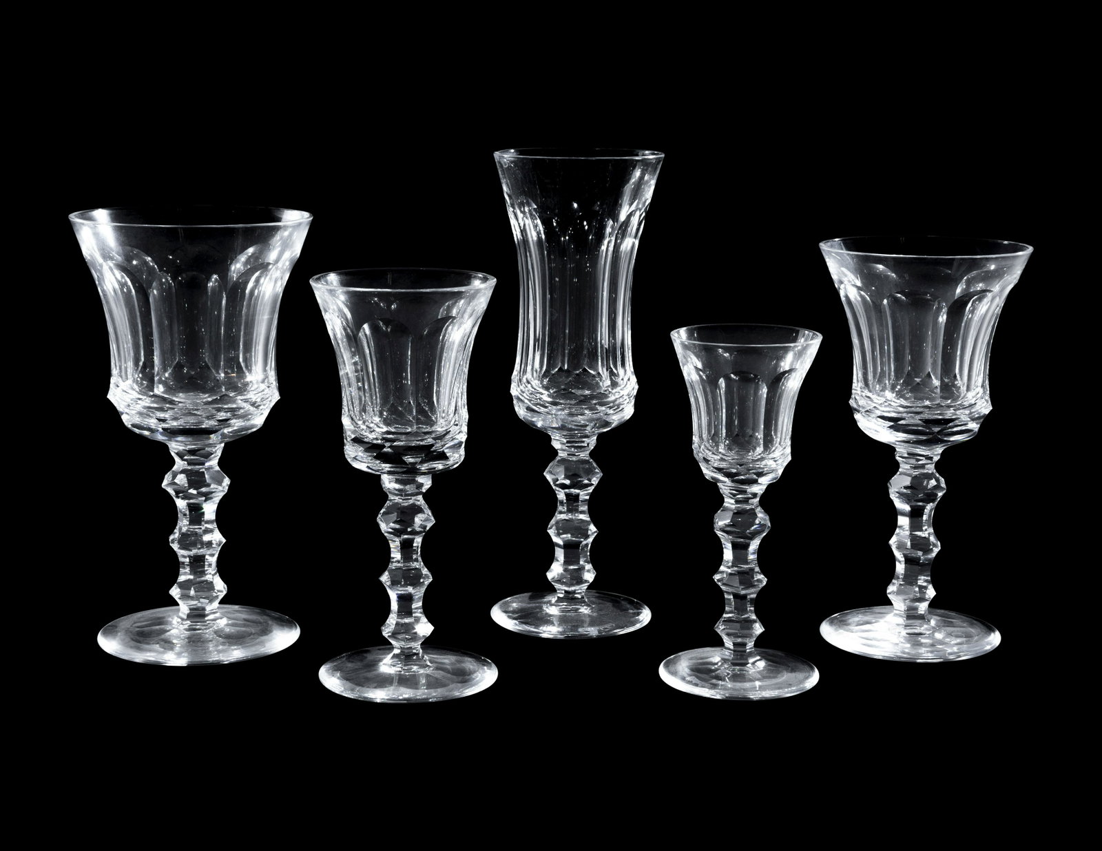 A Group of Waterford Cut Glass Stemware: A Group of Waterford Cut Glass Stemware comprising three flutes, three water goblets, three large wine stems, three small wine stems and three cordial glasses; 15 items total. Height of first 7 3/4 in