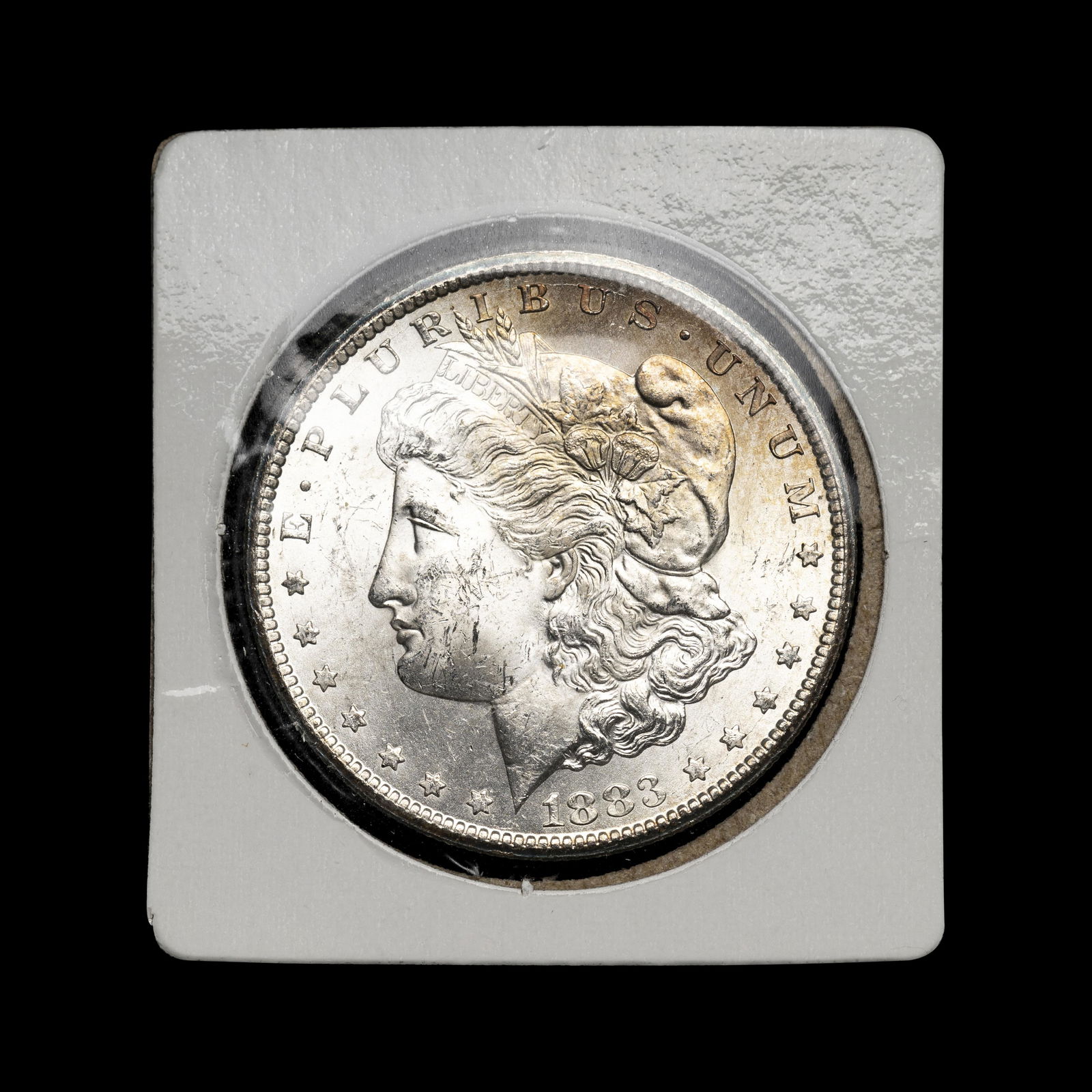 An 1883-CC Morgan $1 Coin (1 of 2)