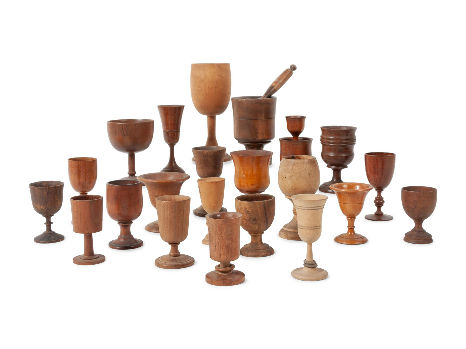 A Large Collection of Treenware Vessels: A Large Collection of Treenware Vessels 19th Century comprising an assembled group of 22 egg cups, salts and assorted vessels. Height of tallest 6 3/4 inches. This lot is located in Denver. Property f