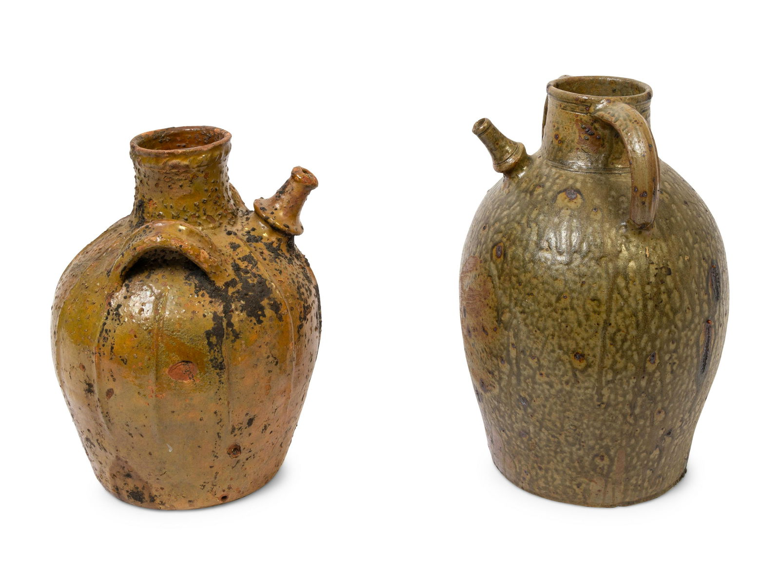 Two French Glazed Earthenware Wine Jugs: Two French Glazed Earthenware Wine Jugs 19th Century Height of taller 17 inches. This lot is located in Denver.