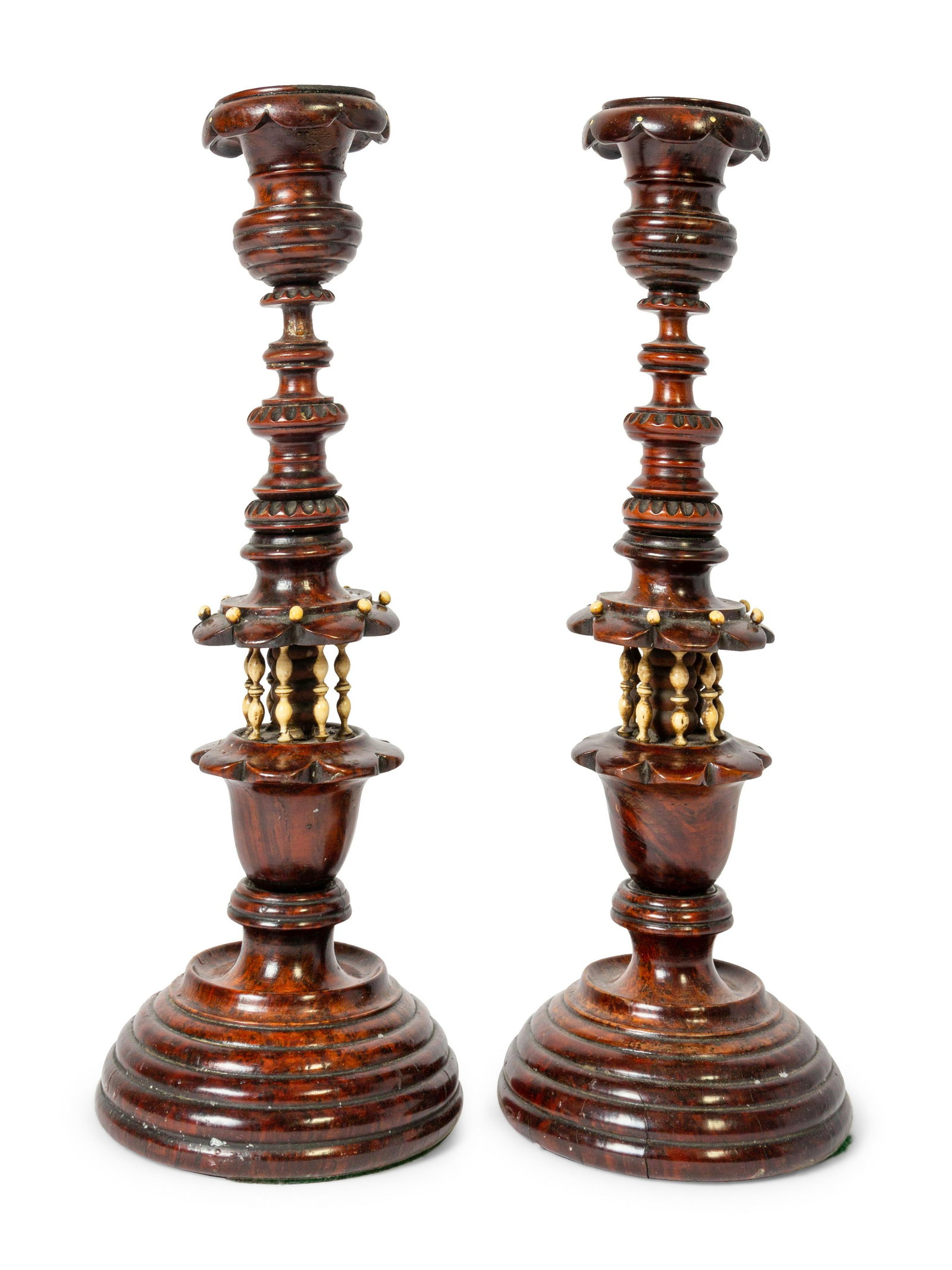 A Pair of Continental Wooden Candlesticks: A Pair of Continental Wooden Candlesticks This lot is located in Denver.