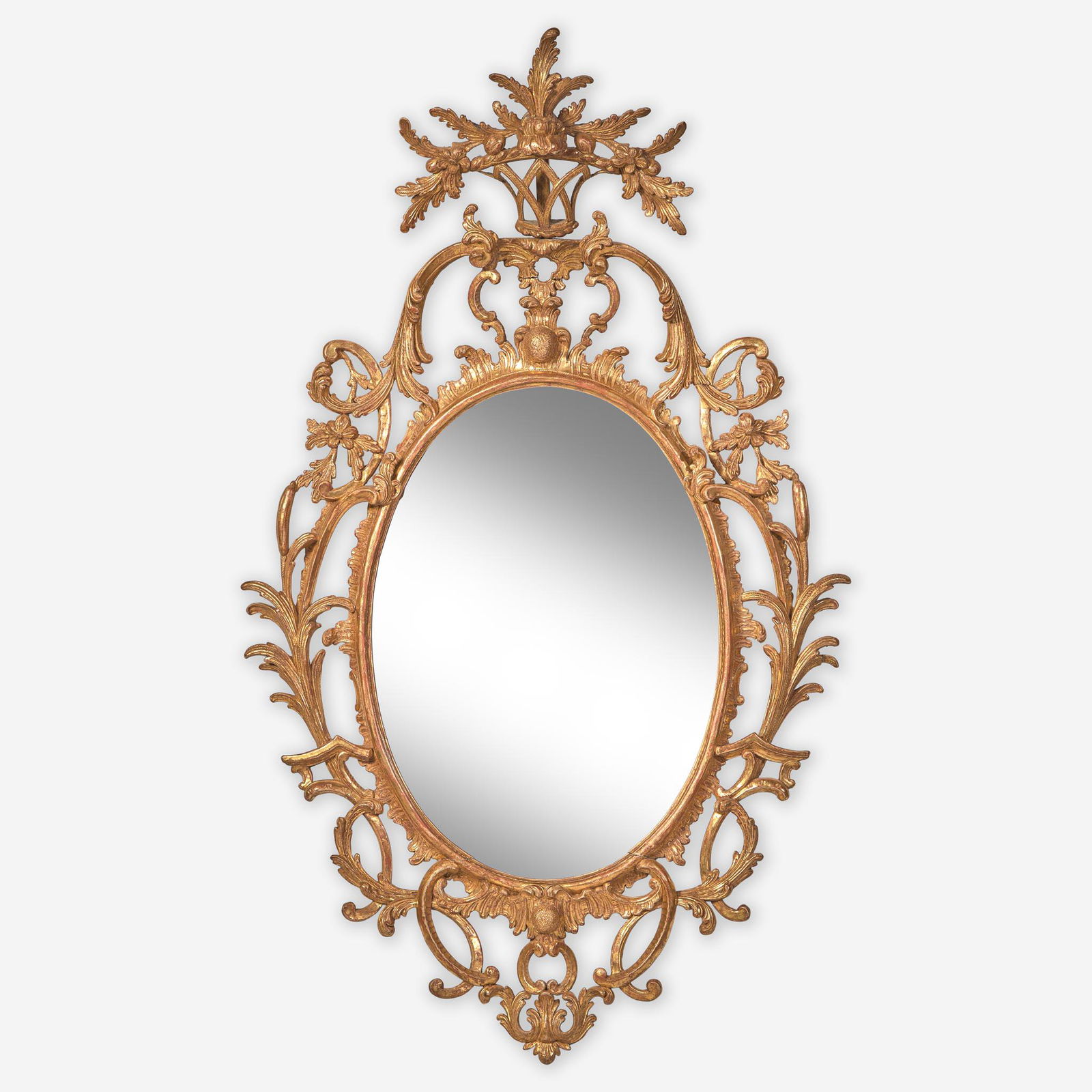 A rare Chippendale oval carved and gilded pine looking glass Probably English, circa (1 of 1)