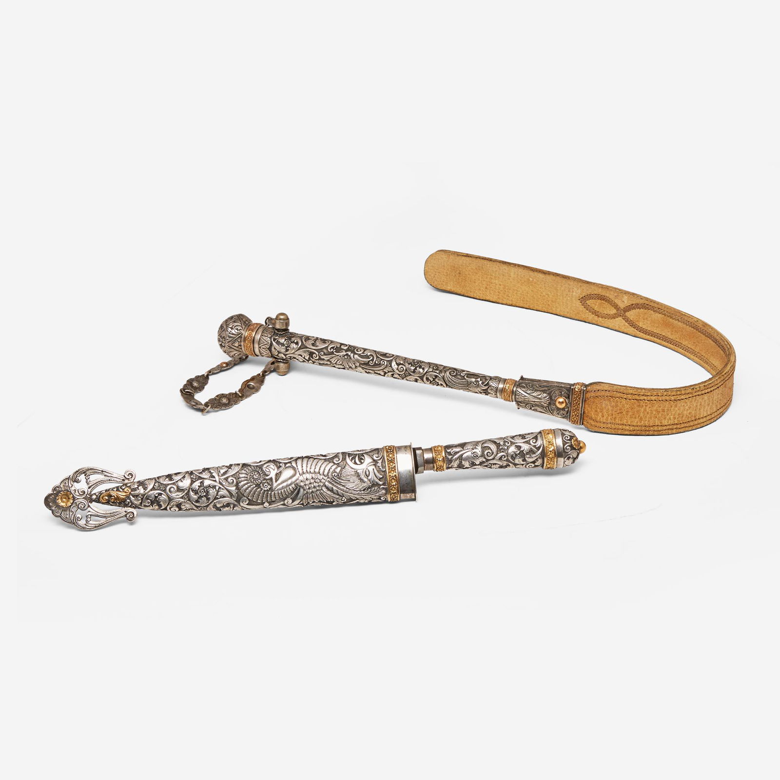 A repoussé silver and gold gaucho knife and flogger Heinrich Böker & Co. Arbolito S.A., (1 of 3)