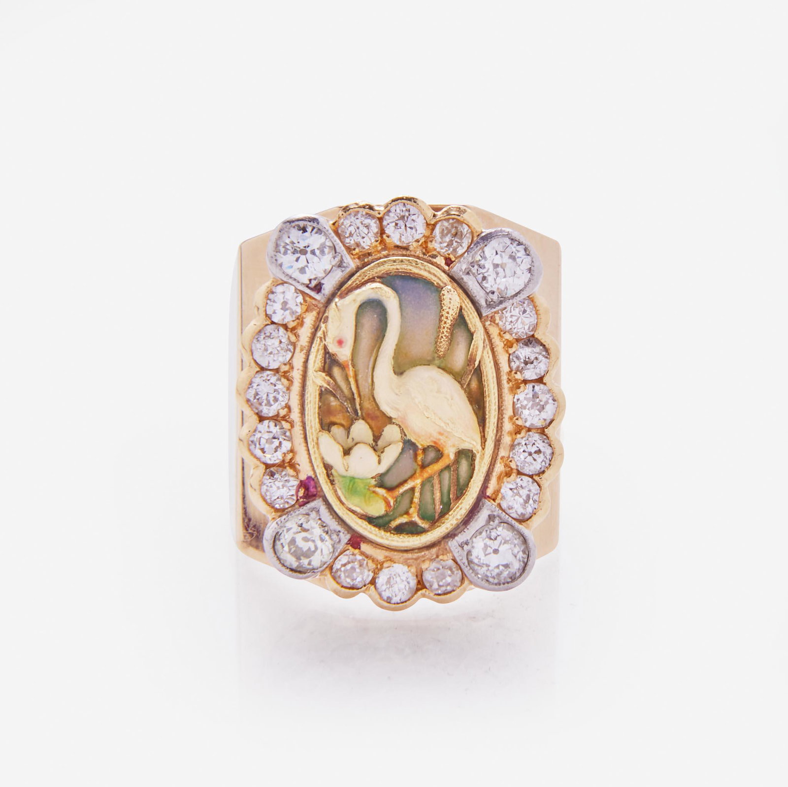 A 14K Yellow Gold Art Nouveau Ring: A 14K Yellow Gold Art Nouveau Ring A 14K yellow gold Art Nouveau ring centering a plique-a-jour enamel crane motif surrounded by a diamond halo set in bezels with milgrain edge. The twenty old Europea