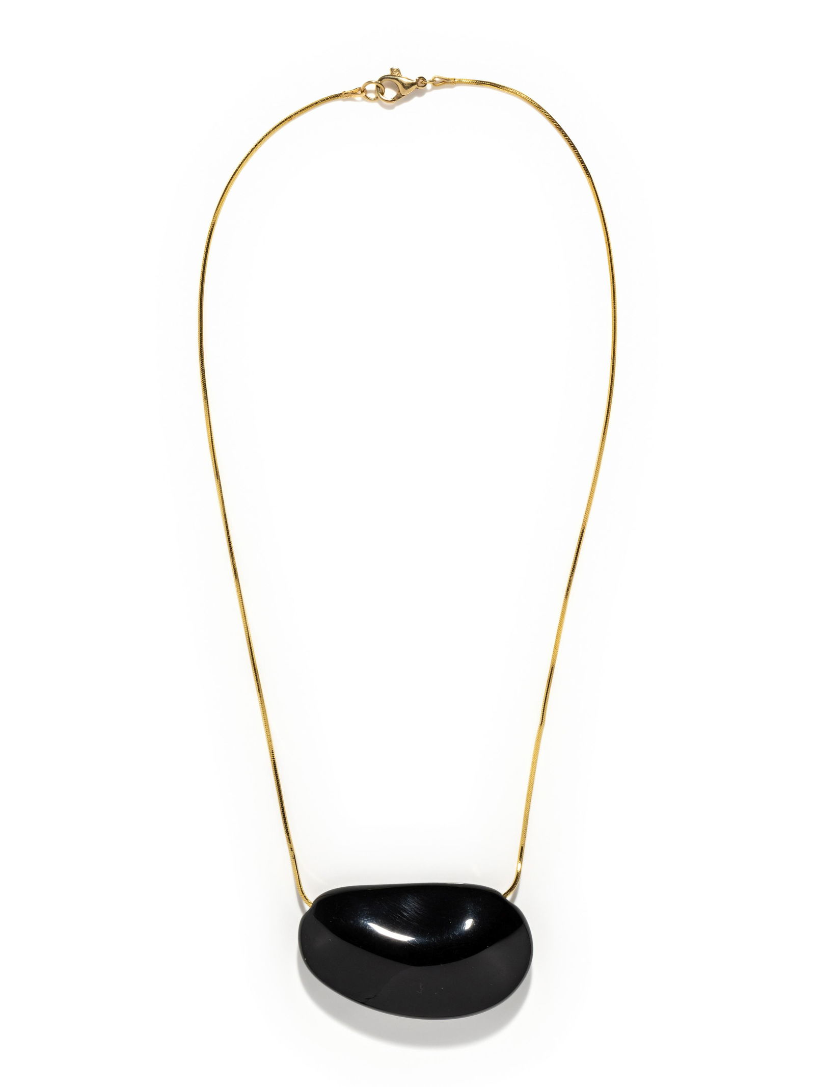 TIFFANY & CO., ELSA PERETTI, LACQUER BEAN PENDANT: TIFFANY & CO., ELSA PERETTI, LACQUER BEAN PENDANT Consisting of a black lacquer bean measuring approximately 1 1/8 x 2 inches, suspended from a yellow gold chain. 18 inches long. Stamp: TIFFANY & CO.