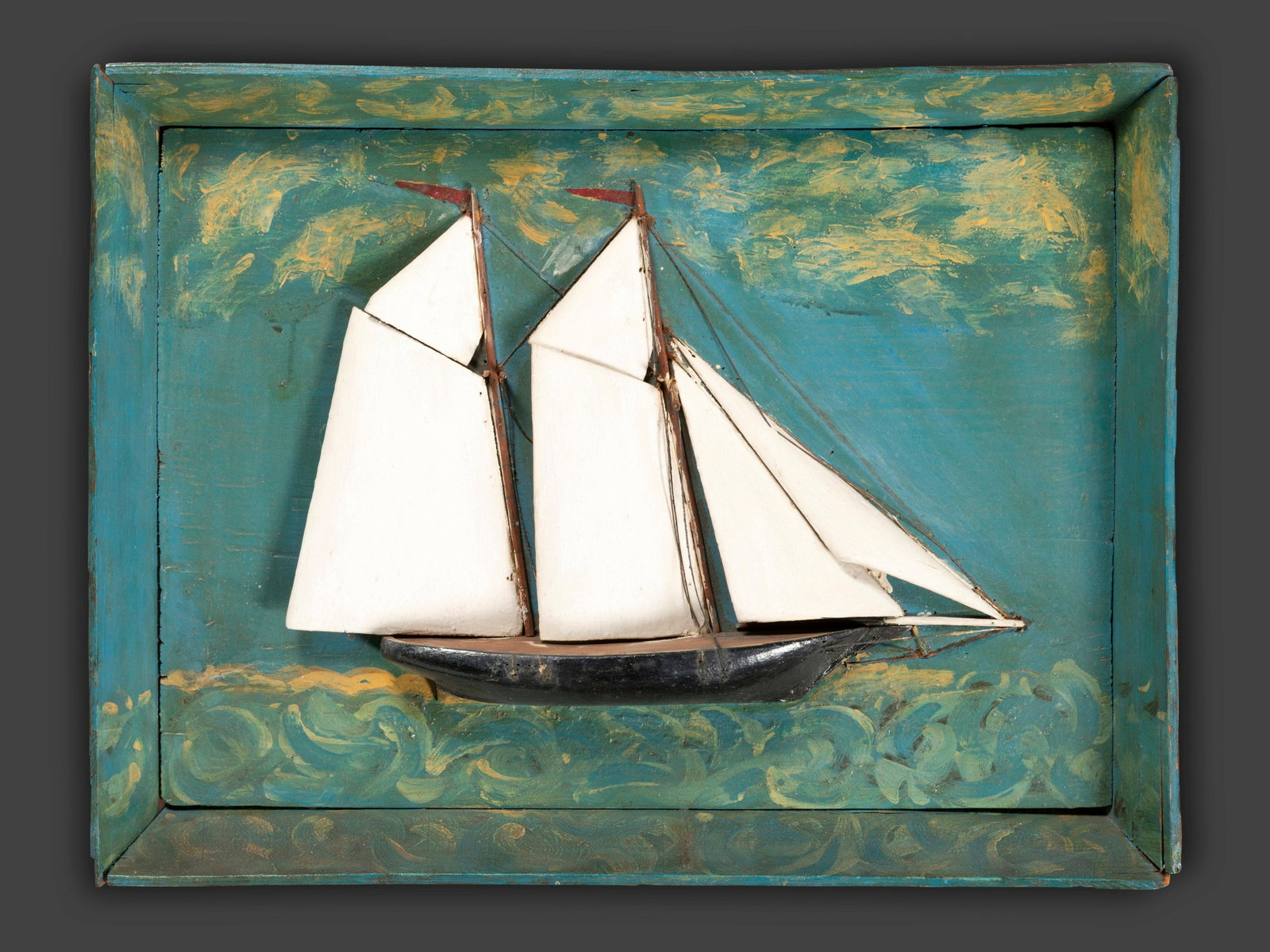 A Carved and Painted Wood Clipper Ship Diorama: A Carved and Painted Wood Clipper Ship Diorama 20th Century 15 1/8 x 19 7/8 inches. This lot is located in Cincinnati. Property from the collection of Jonathan Holstein, San Francisco, CA