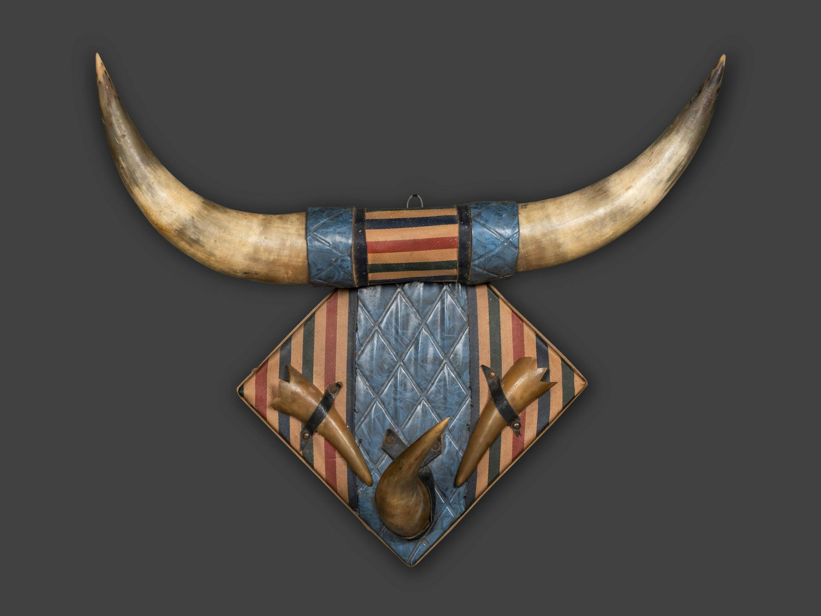 A Patriotic Steer Horn and Fabric Folk Art Wall Plaque: A Patriotic Steer Horn and Fabric Folk Art Wall Plaque 20th Century Height 21 x width of horns 24 inches x depth 9 1/2 inches. This lot is located in Cincinnati. Property from the collection of Jonath