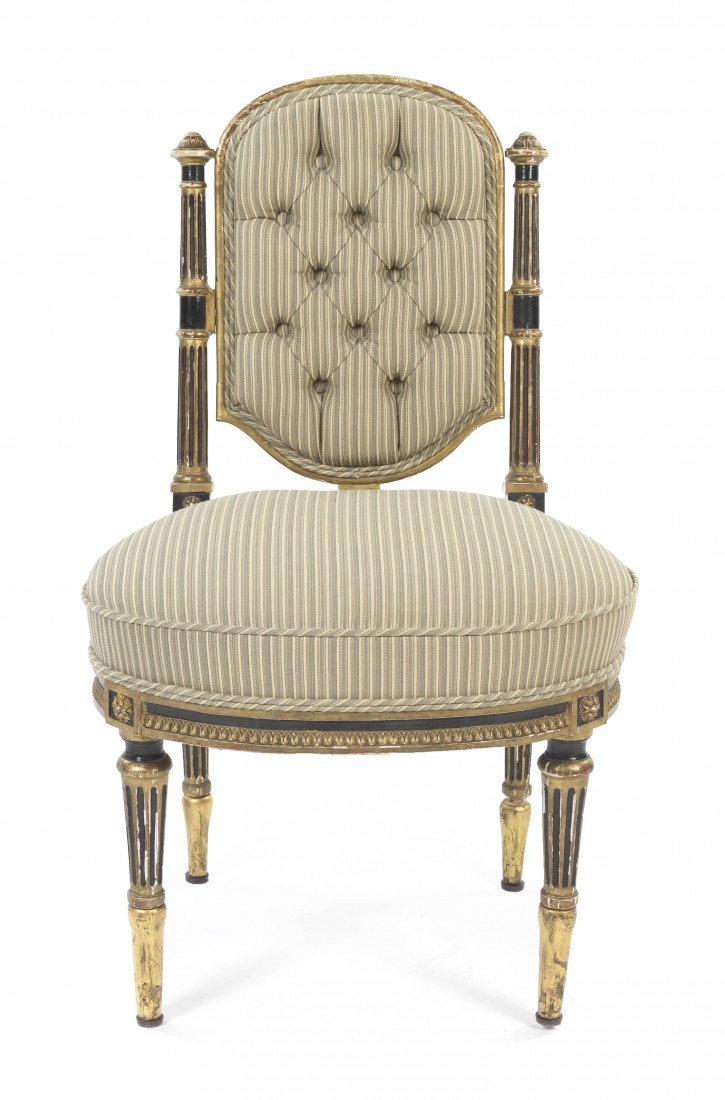 A Louis XVI Style Gilt and Parcel Ebonized Side Ch: A Louis XVI Style Gilt and Parcel Ebonized Side Chair, having an upholstered button tufted back and seat within a rosette carved frame, raised on tapering fluted legs. Height 33 inches.