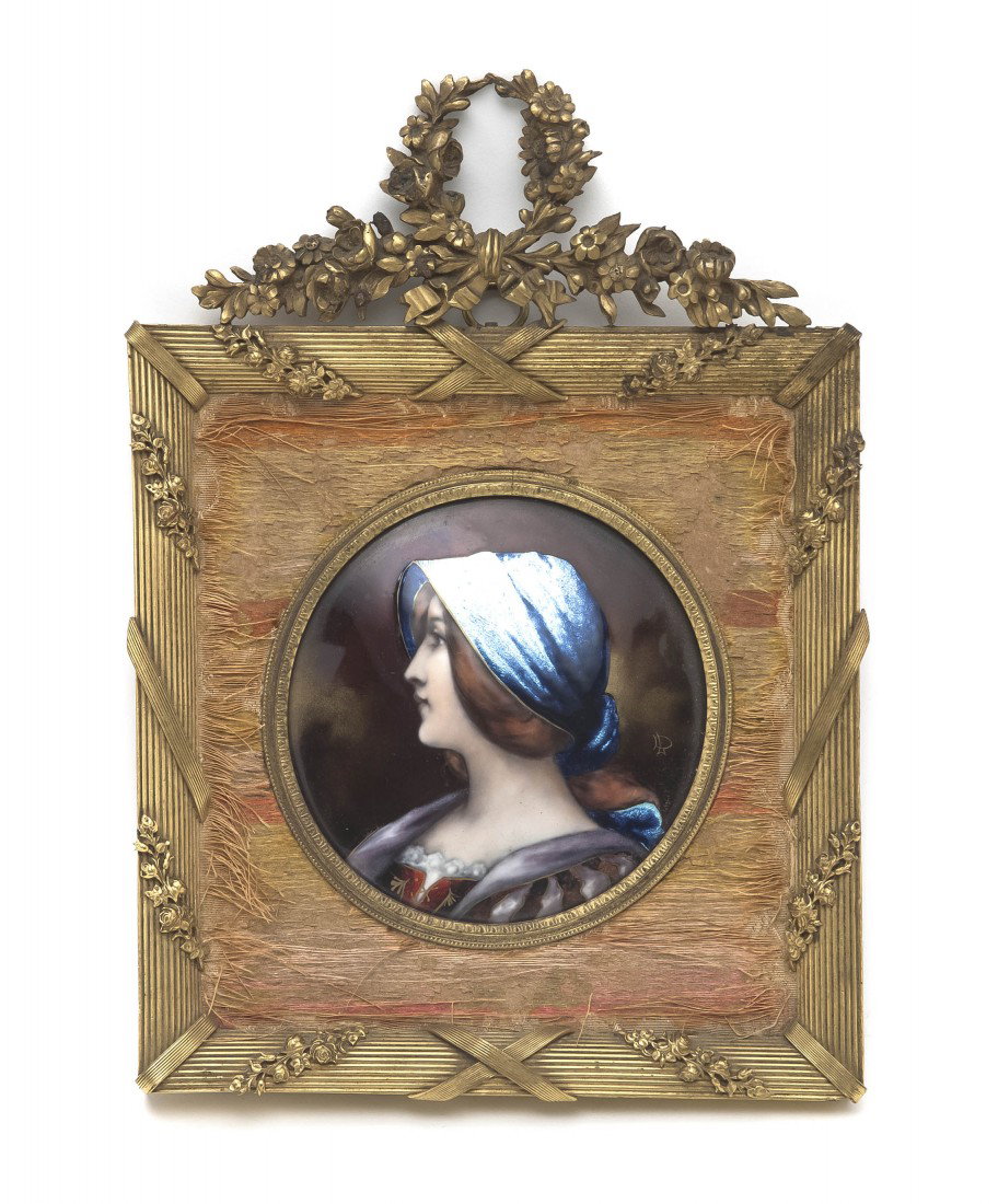 A French Enameled Copper Plaque, Diameter 3 3/4 in: A French Enameled Copper Plaque, depicting a woman with a blue bonnet, signed DL, set in a gilt metal frame with a wreath crest. Diameter 3 3/4 inches. Property from the Estate of Lila Meitus Lang, Ch