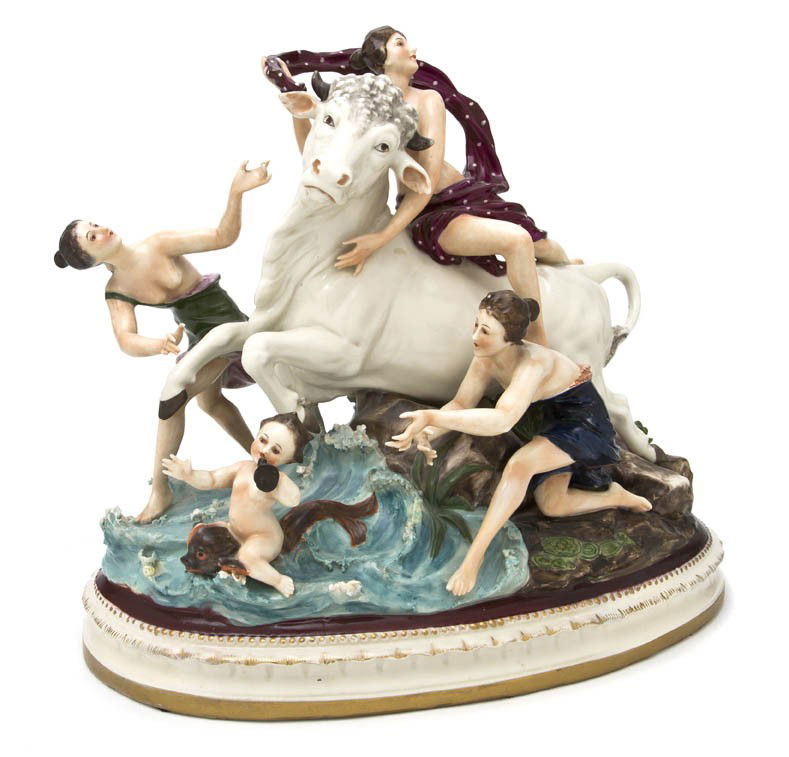 A Capodimonte Porcelain Figural Group, Width 13 7/: A Capodimonte Porcelain Figural Group, depicting Europa's abduction by Zeus disguised as the bull, set on a naturalistic base in the form of waves crashing against rocks with two draped maidens and a