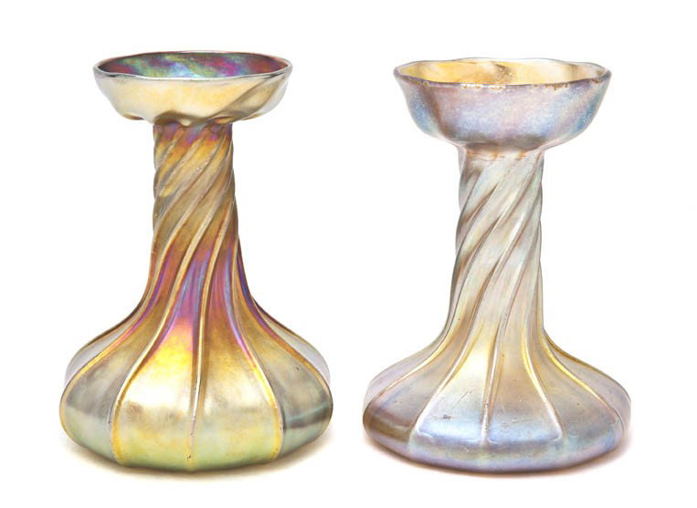 A Near Pair of Tiffany Studios Favrile Glass Candl: A Near Pair of Tiffany Studios Favrile Glass Candlesticks, each having a twisted stem with gold iridescence, signed L.C.T. Favrile, one drilled. Height 5 1/2 inches.
