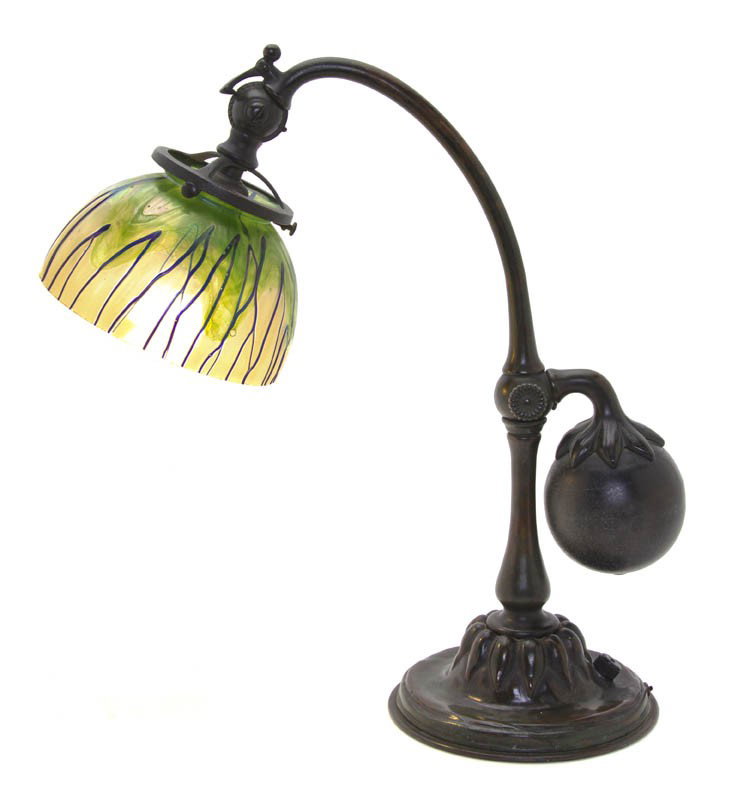 A Tiffany Studios Patinated Bronze Counterbalance : A Tiffany Studios Patinated Bronze Counterbalance Table Lamp, having an Austrian glass shade, the base marked Tiffany Studios New York 415. Height overall 16 3/8 x diameter of shade 6 inches.
