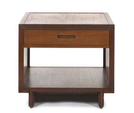 An American Mahogany Side Table, Frank Lloyd Wrigh: An American Mahogany Side Table, Frank Lloyd Wright for Heritage Henredon, having a rectangular top over a single drawer with a recessed handle and a Taliesin design at the edges, raised on sledge fee