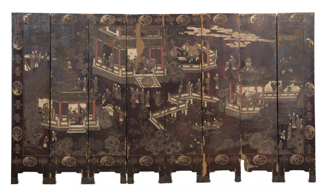 A Chinese Eight Panel Coromandel Lacquer Floor Scr: A Chinese Eight Panel Coromandel Lacquer Floor Screen, Qing Dynasty, the front depicting figures at various activities amongst a garden with whimsical scenes with a repetitive border of gilt oval meda