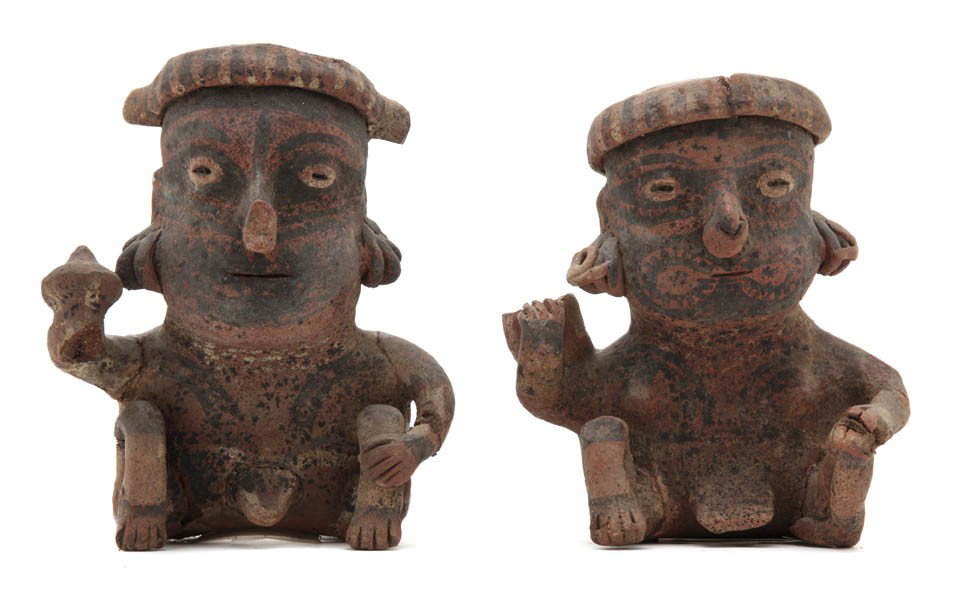 A Pair of Mexican Pre-Columbian Terracotta Figures: A Pair of Mexican Pre-Columbian Terracotta Figures, Nayarit, each seated figure with headbands and having one arm raised, bearing remnants of polychrome decoration throughout. Height of taller 7 1/2 i