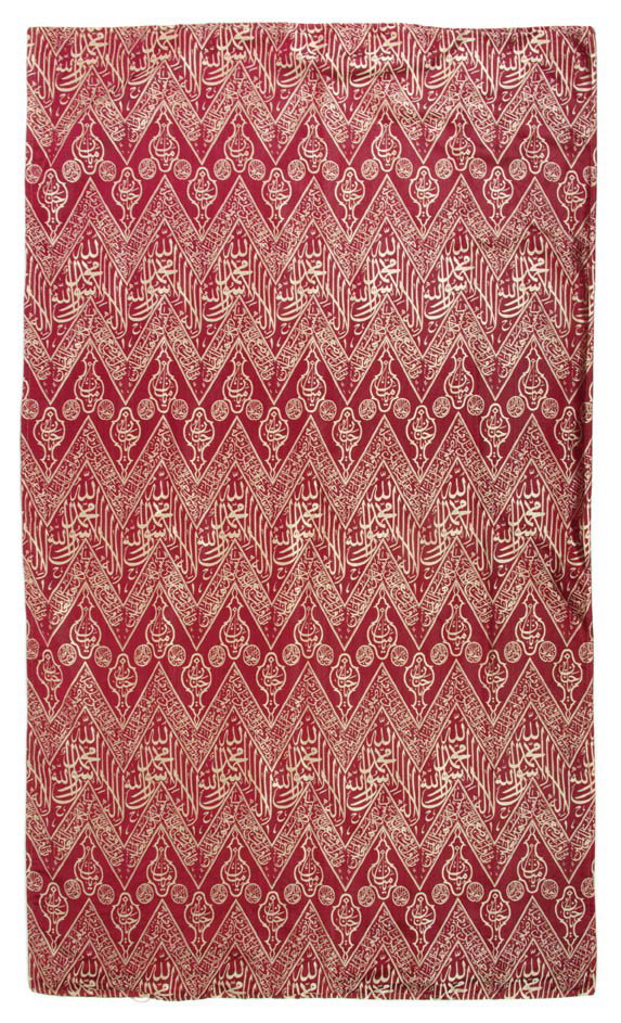 A Middle Eastern Silk Textile, Height 27 1/2 x wid: A Middle Eastern Silk Textile, decorated with calligraphic embroidery throughout in gold thread on a red ground. Height 27 1/2 x width 46 1/2 inches.