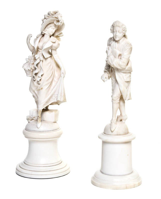 Two Continental Carved Ivory Figures, Height overa: Two Continental Carved Ivory Figures, depicting a lady and a gentleman, each raised on a cylindrical base. Height overall 7 1/2 inches. Property from the Estate of Marjorie I. Mitchell, Chicago, Illin