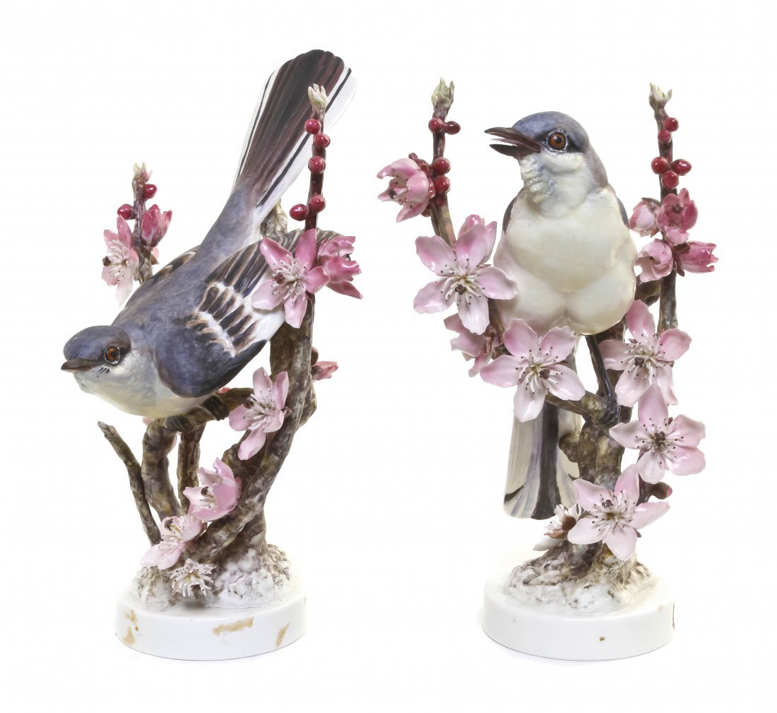 A Pair of Royal Worcester Dorothy Doughty Birds, M: A Pair of Royal Worcester Dorothy Doughty Birds, Mocking Birds, perched on peach blossom branches. Height 10 1/2 inches.