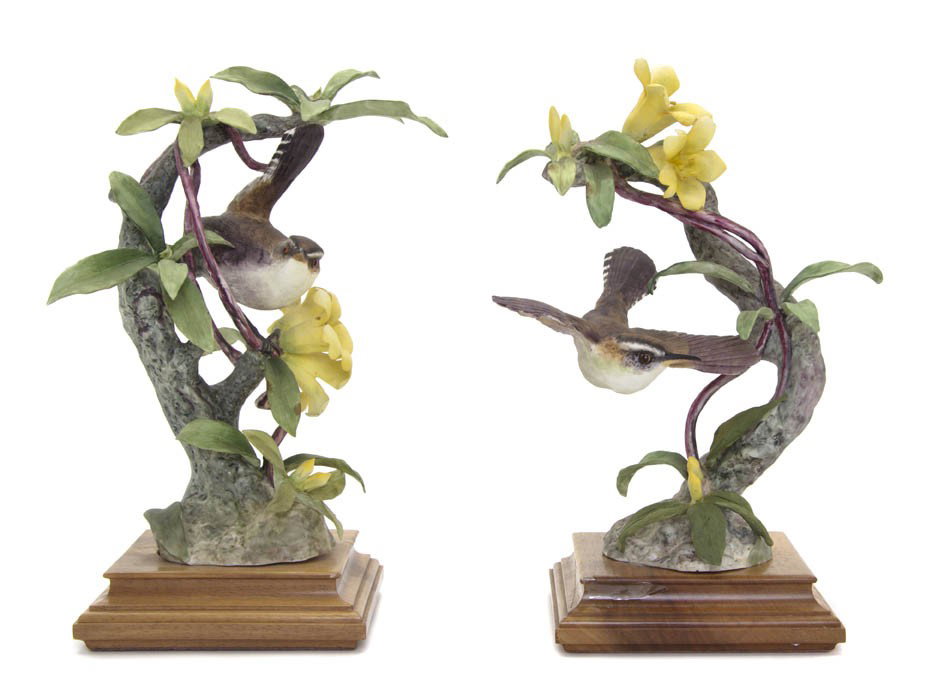 A Pair of Royal Worcester Dorothy Doughty Birds, B: A Pair of Royal Worcester Dorothy Doughty Birds, Bewick's Wrens, one in flight, the other perched on yellow jasmine. Height 10 inches.