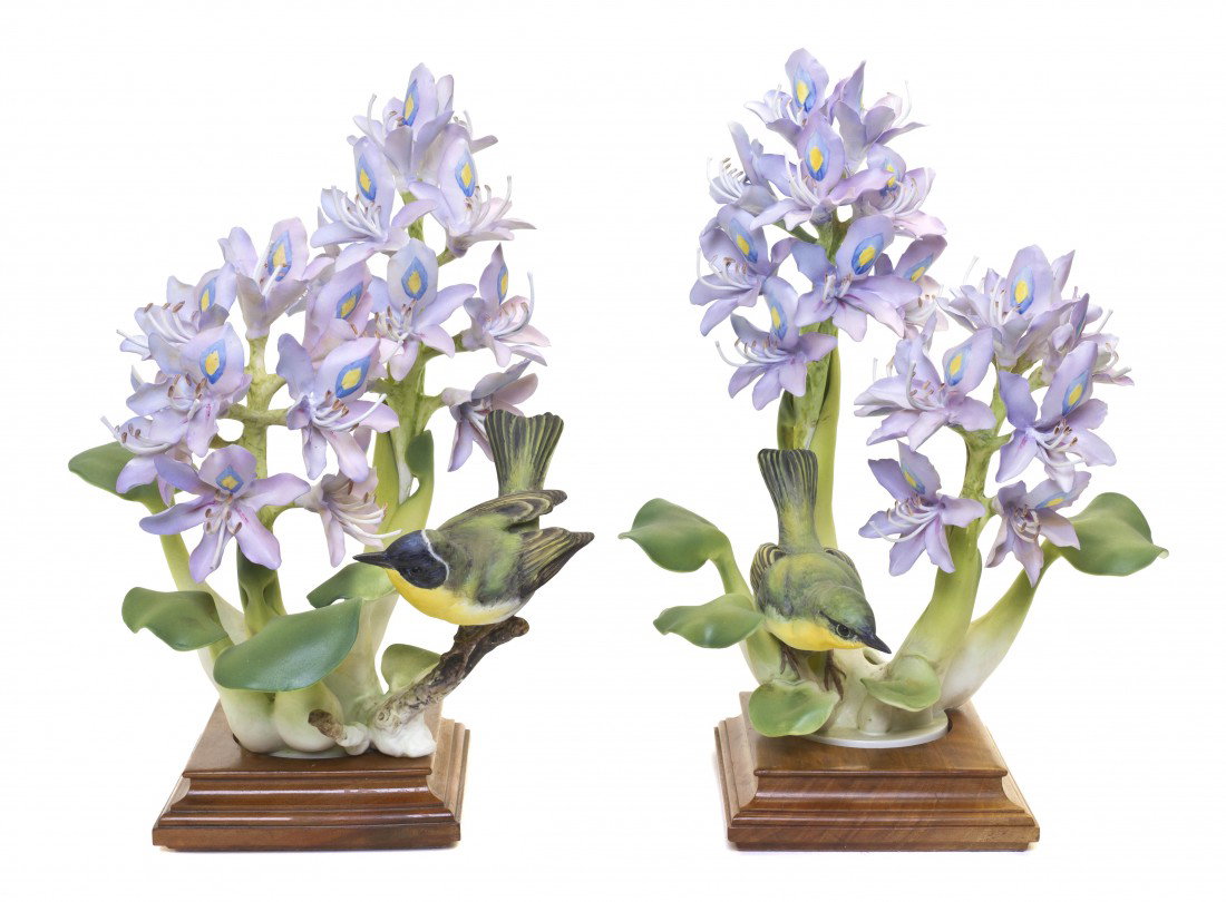A Pair of Royal Worcester Dorothy Doughty Birds, Y: A Pair of Royal Worcester Dorothy Doughty Birds, Yellow-Throats, perched on water hyacinth. Height 12 inches.