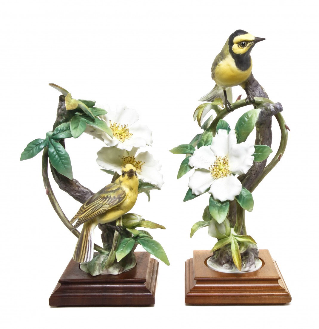 A Pair of Royal Worcester Dorothy Doughty Birds, H: A Pair of Royal Worcester Dorothy Doughty Birds, Hooded Warbler, perched on cherokee rose. Height 12 1/2 inches.