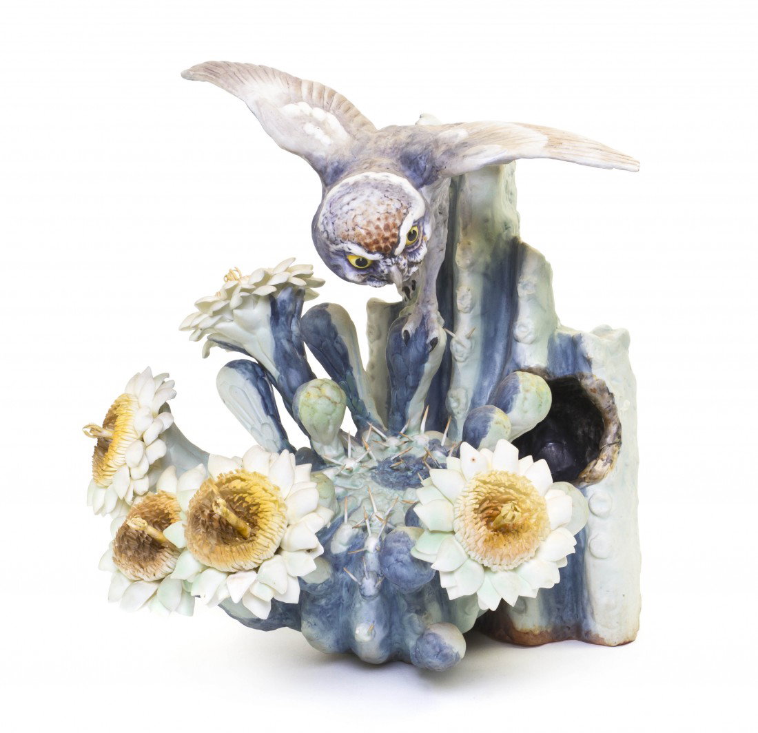 A Royal Worcester Dorothy Doughty Bird, Elf Owl, H: A Royal Worcester Dorothy Doughty Bird, Elf Owl, perched on a squaro cactus. Height 11 1/2 inches.