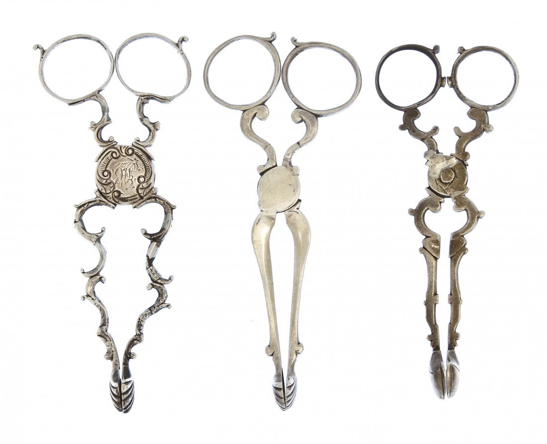 A Pair of English Silver Sugar Tongs, Thomas Hanna: A Pair of English Silver Sugar Tongs, Thomas Hannam & Richard Mills, London, second half 18th century, together with two associated examples, one marked I.C., the other W.P., approximate total weight 
