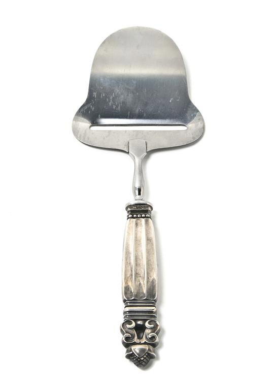 A Danish Silver Cheese Server, Georg Jensen, Leng: A Danish Silver Cheese Server, Georg Jensen, in the Acorn pattern, with a stainless steel blade. Length 8 1/4 inches.