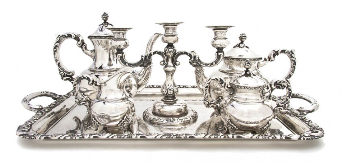 A German Silver Tea and Coffee Service, Emil Herm: A German Silver Tea and Coffee Service, Emil Hermann, Waldstetten, comprising a teapot and a coffee pot with rose form finials, a creamer and an open sugar, each marked .925 sterling with four applied