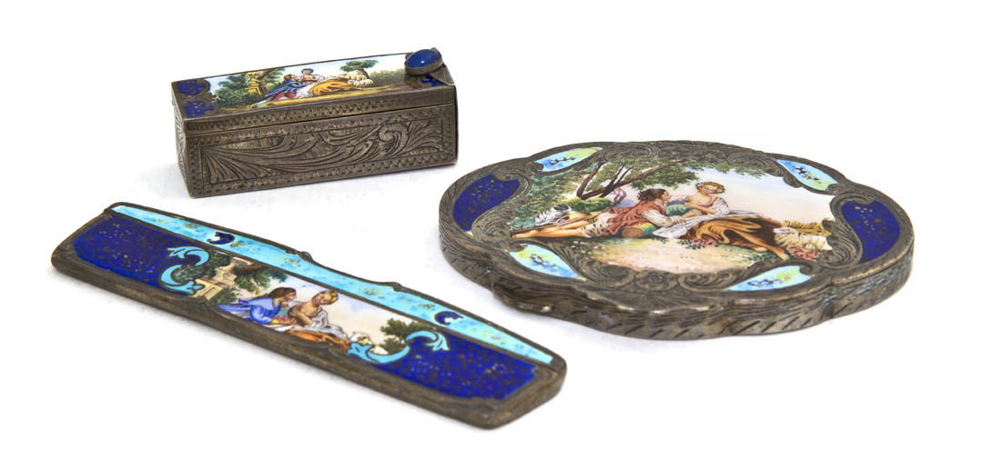 A Continental Silver and Enameled Dresser Set, Wi: A Continental Silver and Enameled Dresser Set, comprising a comb, a lipstick case and a powder compact, each decorated with a courting couple in a landscape and cobalt enamel, silver marked 800. Width