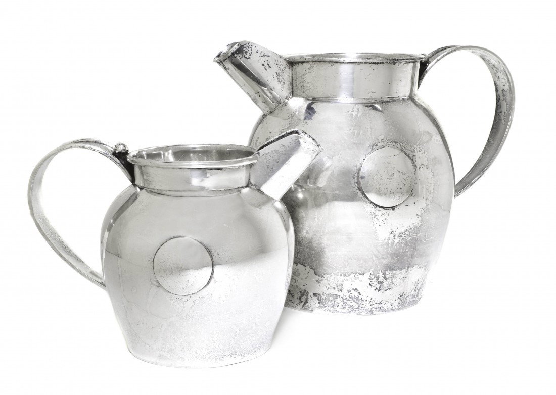 Two Mexican Sterling Silver Pitchers, William Sp: Two Mexican Sterling Silver Pitchers, William Spratling, each of baluster form with a strap handle and an applied circular roundel to each side, each marked underneath the handle; approximate total we