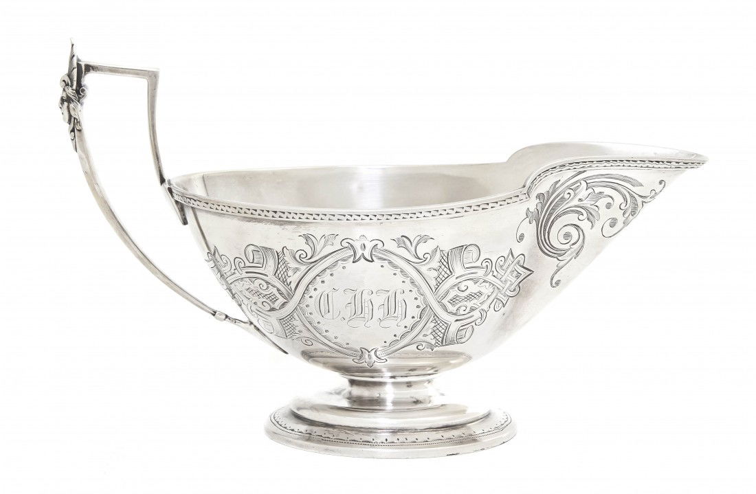 An American Sterling Silver Sauce Boat, John Wend: An American Sterling Silver Sauce Boat, John Wendt for Ball, Black & Co., New York, in the Medallion pattern, having incised classical decoration throughout and a female mask applied to the handle, on