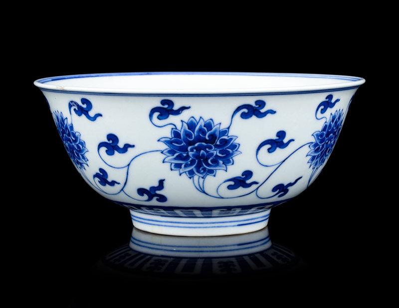A Chinese Blue and White 'Lotus' Porcelain Bowl: Description A Chinese Blue and White 'Lotus' Porcelain Bowl Qing Dynasty (1644-1912) Diameter 6 1/4 in., 16 cm. Size Diameter 6 1/4 in., 16 cm. Proven