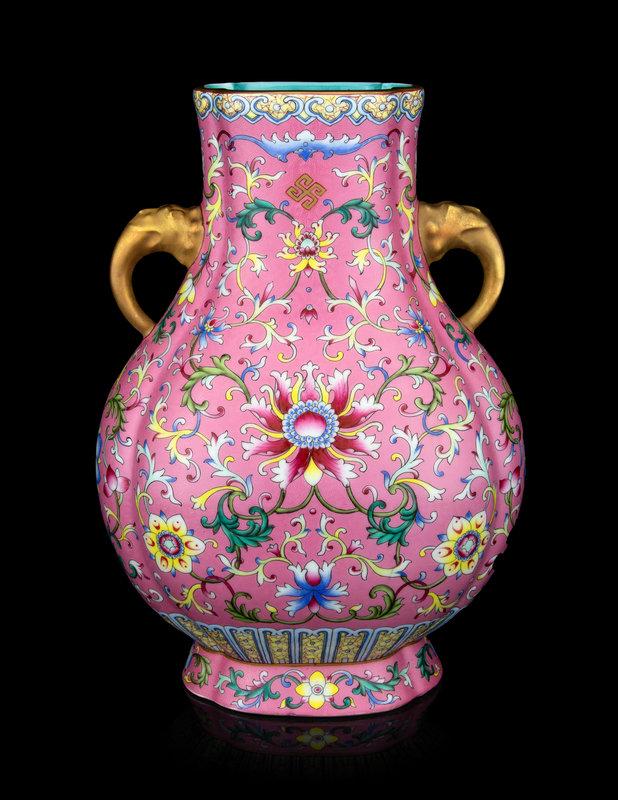 A Chinese Famille Rose Porcelain 'Lotus' Vase: A Chinese Famille Rose Porcelain 'Lotus' Vase having a lobed outline, painted to the extior with lotus scrolls against a pink ground, the waisted neck applied with a pair of gilt enameled handles.&nbs