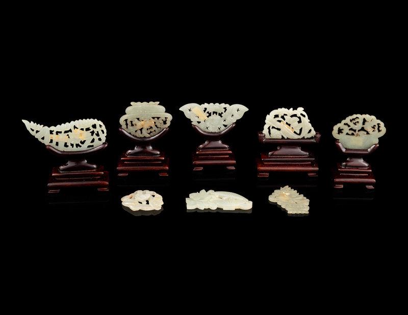 Eight Chinese Pale Celadon Jade Plaques: Eight Chinese Pale Celadon Jade Plaques Length of the largest 2 1/4 in., 5.7 cm. This lot is located in Chicago. Size Length of the largest 2 1/4 in., 5.7 cm.