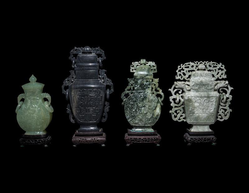 Four Chinese Jadeite and Hardstone Covered Vases: Four Chinese Jadeite and Hardstone Covered Vases 20th Century comprising three jadeite examples and one serpentine example. Height of tallest with stand 11 1/8 in., 28.4 cm. Size