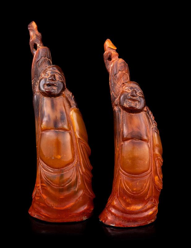A Pair of Chinese Carved Buffalo Horn Figures: A Pair of Chinese Carved Buffalo Horn Figures Height of taller 8 1/4 in., 21 cm. This lot is located in Chicago. Property from the Estate of Mr. and Mrs. Maurice Fry, Hoffman Estates, Illi