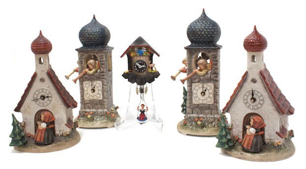 A Collection of Five Hummel Porcelain Articles, H: A Collection of Five Hummel Porcelain Articles, comprising two Call to Worship clocks, two clocks with a girl entering a church and a Land in Sight figural group, together with a painted wood German c
