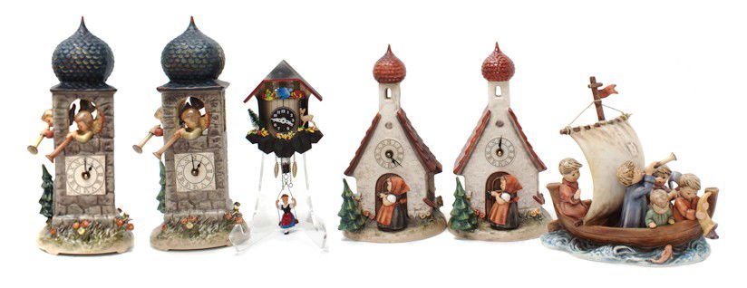 A Collection of Five Hummel Porcelain Articles, H: A Collection of Five Hummel Porcelain Articles, comprising two Call to Worship clocks, two clocks with a girl entering a church and a Land in Sight figural group, together with a painted wood German c