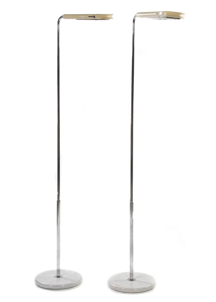 A Pair of Contemporary Italian Chromed Floor Lamp: A Pair of Contemporary Italian Chromed Floor Lamps, each having an adjustable tubular standard set on the circular white marble base. Height 70 1/2 inches. Property from the Collection of Mr. Richard 
