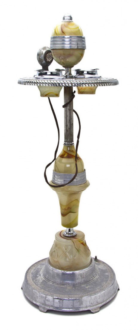 An Art Deco Style Silvered Metal and Onyx Smoking: An Art Deco Style Silvered Metal and Onyx Smoking Stand, having dual ash receivers, raised on a columnar pedestal over the circular base. Height 33 inches.