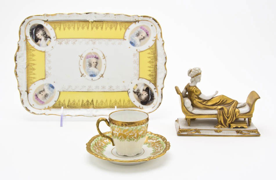 A Collection of Continental Porcelain Articles, W: A Collection of Continental Porcelain Articles, comprising a German figure of a woman sitting on a chaise, a Limoges teacup and saucer and a Bavarian tray. Width of first 5 1/4 inches. Property from t