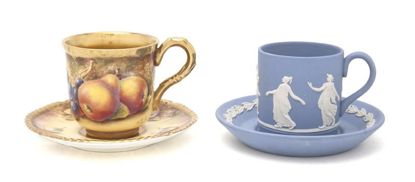 A Royal Worcester Cup and Saucer, Diameter of sau: A Royal Worcester Cup and Saucer, having a gilt interior and borders with fruit study decoration, signed D. Fuller, together with a Wedgwood Jasperware cup and saucer having classical decoration on a