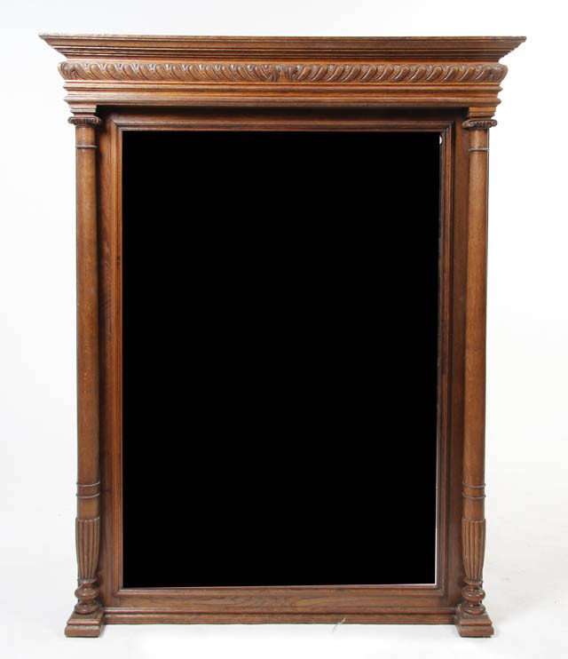 A Neoclassical Mahogany Mirror, Height 60 1/2 x w: A Neoclassical Mahogany Mirror, having a stepped cornice with a carved frieze above the rectangular plate flanked by Ionic columns. Height 60 1/2 x width 47 inches.
